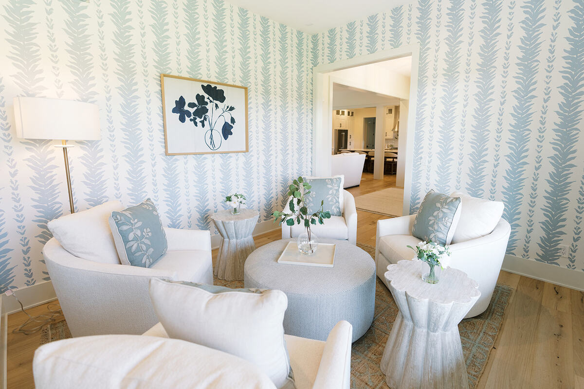 sitting room with light blue accents and white furniture